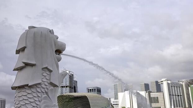 View of the Merlion statue and city skyline Singapore. View of the Merlion statue and city skyline Singapore.