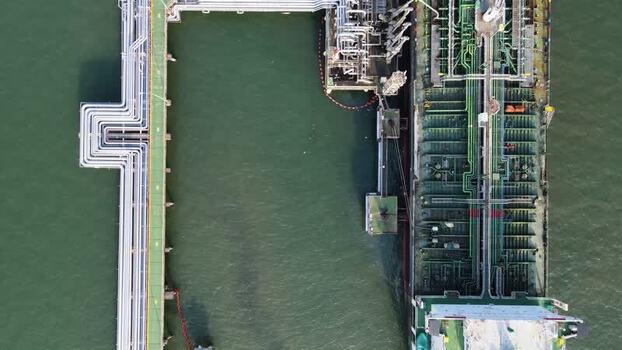 Aerial view of oil tanker at industrial terminal Indonesia. Aerial view of oil tanker at industrial terminal Indonesia.