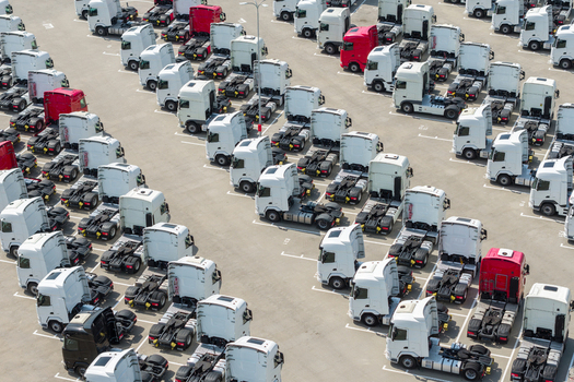 Warsaw Poland 16 August 2026 Aerial view of a large parking lot filled with numerous semi trucks parked in orderly rows. Warsaw Poland 16 August 2026 Aerial view of a large parking lot filled with numerous semi trucks parked in orderly rows.