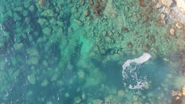 Aerial view of clear turquoise water along the coast Cyprus.