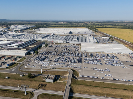 Aerial view of the Volkswagen Slovakia factory in Devinska Nova Ves with industrial buildings and large parking lots filled with new cars in Bratislava Bratislavsky kraj Slovakia. Aerial view of the Volkswagen Slovakia factory in Devinska Nova Ves with industrial buildings and large parking lots filled with new cars in Bratislava Bratislavsky kraj Slovakia.