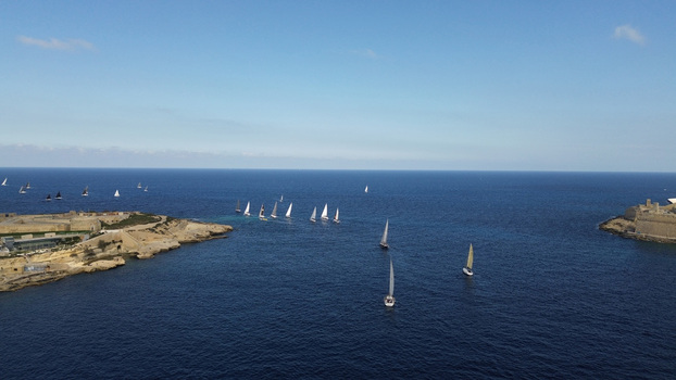 Aerial view of sailboats racing in the Mediterranean Sea near the historic fortifications of Valletta Port Region Malta. Aerial view of sailboats racing in the Mediterranean Sea near the historic fortifications of Valletta Port Region Malta.