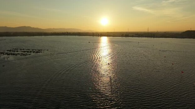 Aerial view of Rowo Jombor lake at sunset Indonesia. Aerial view of Rowo Jombor lake at sunset Indonesia.