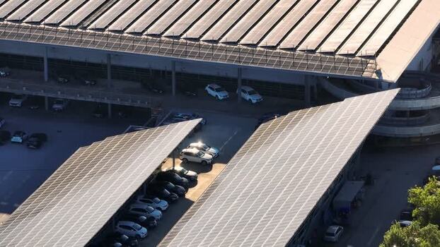 Aerial view of solar panels on a building roof in Ancona Italy.