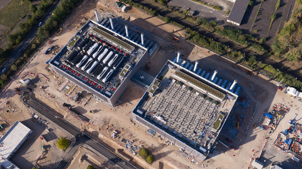 Aerial view of Data4 Hanau data center facility under construction with large industrial buildings rooftop cooling units and surrounding site infrastructure in Hanau Hessen Germany. Aerial view of Data4 Hanau data center facility under construction with large industrial buildings rooftop cooling units and surrounding site infrastructure in Hanau Hessen Germany.