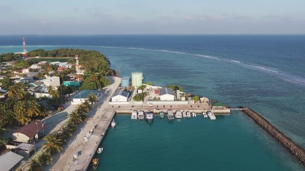 Aerial view of the harbor and tropical coastline Maldives. Aerial view of the harbor and tropical coastline Maldives.