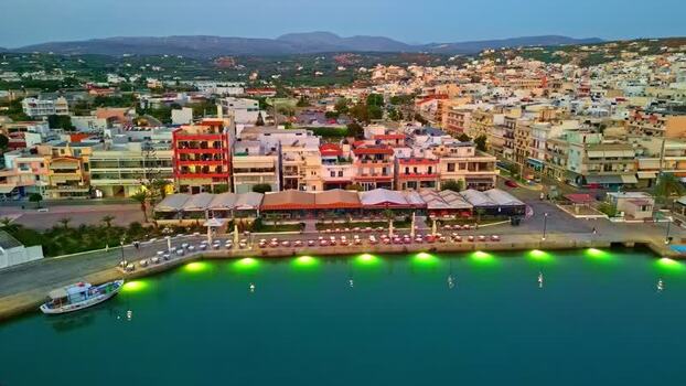 Aerial view of Crete harbor at dusk Greece.
