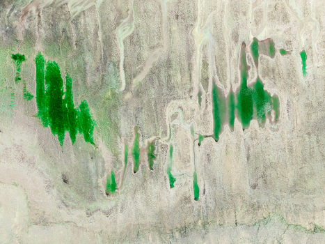 Aerial view of arid landscape with vibrant green phosphor deposits and textured terrain in Andalusia Spain. Aerial view of arid landscape with vibrant green phosphor deposits and textured terrain in Andalusia Spain.
