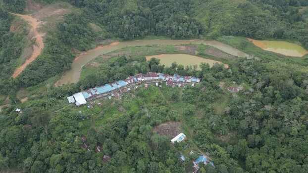 Aerial view of Batang Ai longhouse in the rainforest Malaysia. Aerial view of Batang Ai longhouse in the rainforest Malaysia.