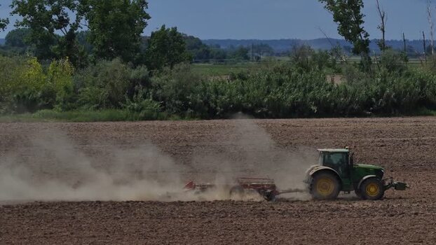 Aerial view of a tractor plowing a field Portugal. Aerial view of a tractor plowing a field Portugal.