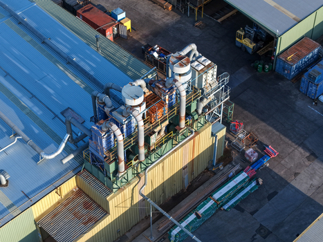 Melbourne VIC Australia 22 September 2026 Aerial view of industrial factory buildings in Kilsyth featuring metal rooftops ventilation pipes and storage containers. Melbourne VIC Australia 22 September 2026 Aerial view of industrial factory buildings in Kilsyth featuring metal rooftops ventilation pipes and storage containers.