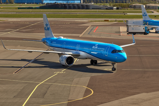 Schiphol Netherlands 16 April 2026 View of a KLM Royal Dutch Airlines Airbus A321neo taxiing on the tarmac under bright sunlight at Schiphol Airport. Schiphol Netherlands 16 April 2026 View of a KLM Royal Dutch Airlines Airbus A321neo taxiing on the tarmac under bright sunlight at Schiphol Airport.
