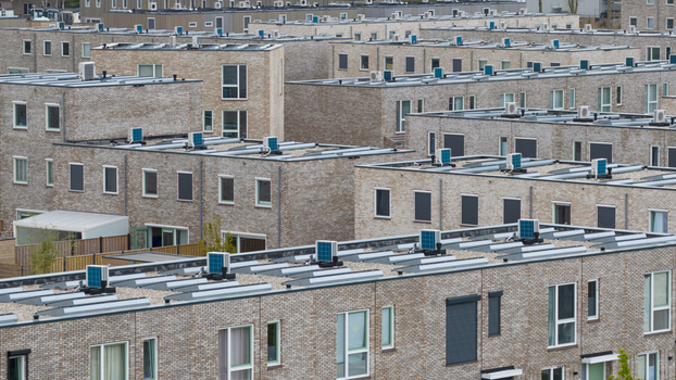 Aerial view of modern brick residential buildings with flat roofs and air conditioning units in Almere Flevoland Netherlands. Aerial view of modern brick residential buildings with flat roofs and air conditioning units in Almere Flevoland Netherlands.