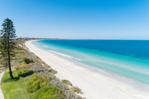 Aerial view of a pristine beach with turquoise water white sand and coastal vegetation in Perth Western Australia Australia. Aerial view of a pristine beach with turquoise water white sand and coastal vegetation in Perth Western Australia Australia.
