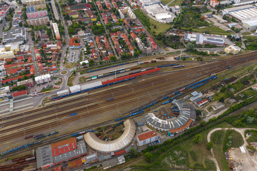 Aerial view of the Breclav railway station and depot with semi circular roundhouses multiple tracks and freight trains in Breclav South Moravian Region Czechia.