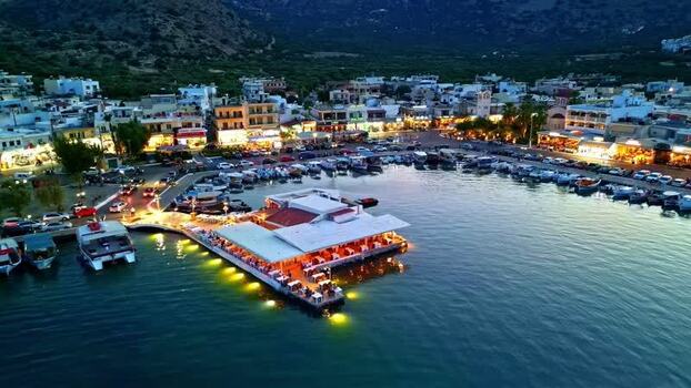 Aerial view of harbor at night in Crete Greece.