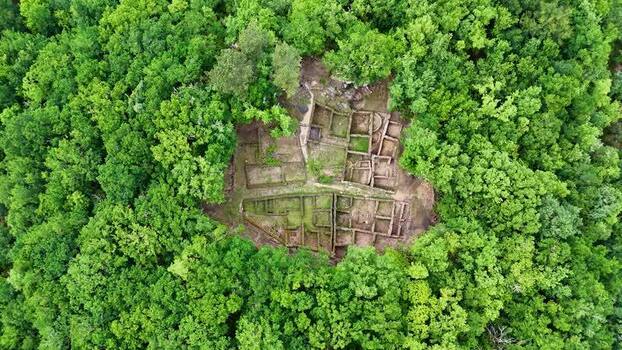 Aerial view of Castro de Armea ruins in a forest Spain.