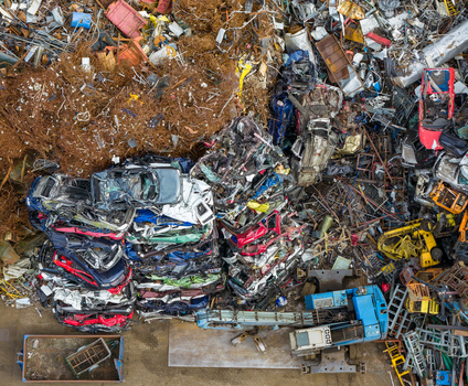 Aerial view of scrapped cars and crushed metal debris piled in a junkyard and recycling site in Hoogeveen Drenthe Netherlands. Aerial view of scrapped cars and crushed metal debris piled in a junkyard and recycling site in Hoogeveen Drenthe Netherlands.