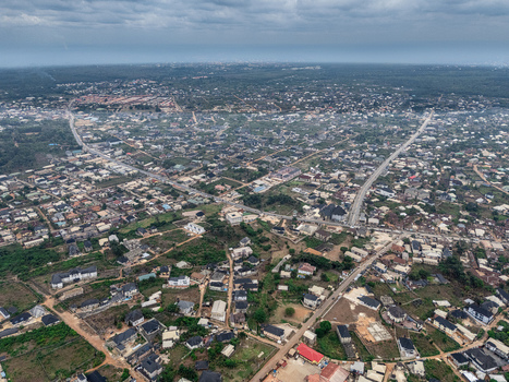 Aerial view of a sprawling residential landscape with a network of roads cutting through the densely built environment Umuahia Abia Nigeria. Aerial view of a sprawling residential landscape with a network of roads cutting through the densely built environment Umuahia Abia Nigeria.