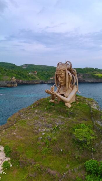 Aerial view of the Goddess of the Sea sculpture on a cliff Indonesia.