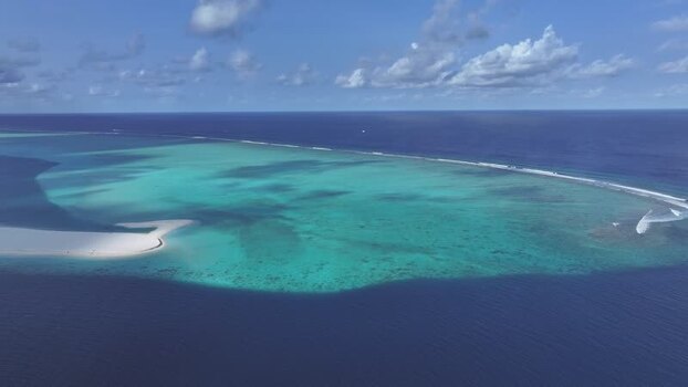 Aerial view of a turquoise lagoon and sandbar Maldives. Aerial view of a turquoise lagoon and sandbar Maldives.