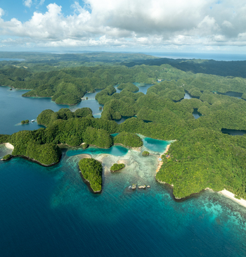 Aerial view of the lush green islands and turquoise lagoons of Bucas Grande surrounded by deep blue ocean waters under a bright sky in Siargao Philippines. Aerial view of the lush green islands and turquoise lagoons of Bucas Grande surrounded by deep blue ocean waters under a bright sky in Siargao Philippines.