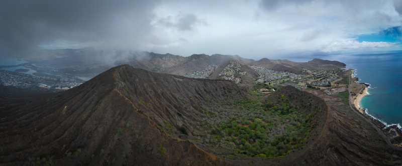 Aerial view of the stark textured landscape of Koko Head volcano crater contrasting with the lush greenery within Honolulu Hawaii United States. Aerial view of the stark textured landscape of Koko Head volcano crater contrasting with the lush greenery within Honolulu Hawaii United States.