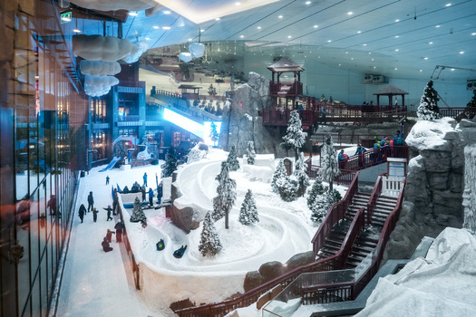 Dubai United Arab Emirates 20 April 2023 View of Ski Dubai featuring indoor snow slopes pine trees and people enjoying winter activities inside the mall. Dubai United Arab Emirates 20 April 2023 View of Ski Dubai featuring indoor snow slopes pine trees and people enjoying winter activities inside the mall.