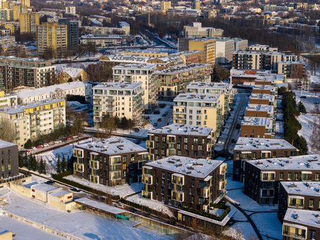 Aerial view of modern residential apartment buildings with snow covered rooftops in a winter urban landscape Vilnius County Lithuania.