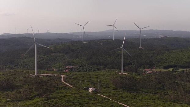 Aerial view of wind turbines on green hills Portugal. Aerial view of wind turbines on green hills Portugal.