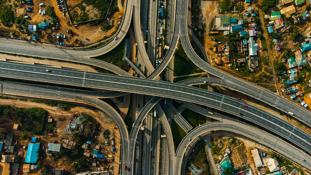 Aerial view of Pokuase Interchange featuring multi level highway ramps concrete roads and surrounding urban development in Ga North Municipal Greater Accra Region Ghana. Aerial view of Pokuase Interchange featuring multi level highway ramps concrete roads and surrounding urban development in Ga North Municipal Greater Accra Region Ghana.