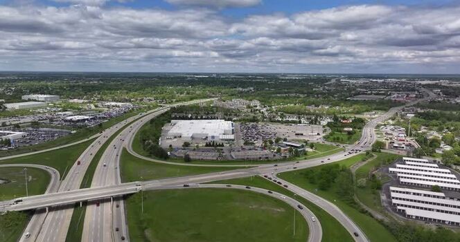 Aerial view of a highway interchange and warehouses United States. Aerial view of a highway interchange and warehouses United States.
