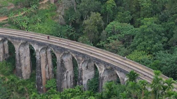 Aerial view of Nine Arches Bridge in lush forest Sri Lanka.