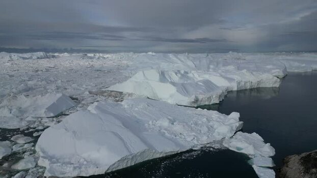 Aerial view of Ilulissat Icefjord in Greenland. Aerial view of Ilulissat Icefjord in Greenland.