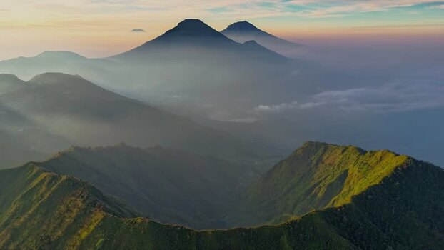 Aerial view of the Dieng Plateau mountains in mist Indonesia.