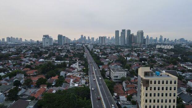 Aerial view of Jalan Pangeran Antasari highway stretching through the dense urban landscape with distant skyscrapers under an overcast sky Kecamatan Cilandak Daerah Khusus Ibukota Indonesia. Aerial view of Jalan Pangeran Antasari highway stretching through the dense urban landscape with distant skyscrapers under an overcast sky Kecamatan Cilandak Daerah Khusus Ibukota Indonesia.