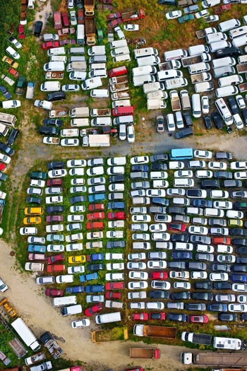 Aerial view of a large junkyard with rows of abandoned cars and vans parked on a grassy field Silivri Istanbul Turkey. Aerial view of a large junkyard with rows of abandoned cars and vans parked on a grassy field Silivri Istanbul Turkey.