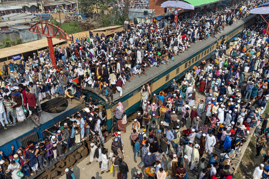 Tongi Bangladesh 04 February 2024 Aerial view of Tongi Junction railway station crowded with thousands of people sitting on train roofs and platforms during a religious gathering. Tongi Bangladesh 04 February 2024 Aerial view of Tongi Junction railway station crowded with thousands of people sitting on train roofs and platforms during a religious gathering.