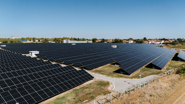 Aerial view of a large solar farm with rows of photovoltaic panels in Temerin Vojvodina Serbia. Aerial view of a large solar farm with rows of photovoltaic panels in Temerin Vojvodina Serbia.