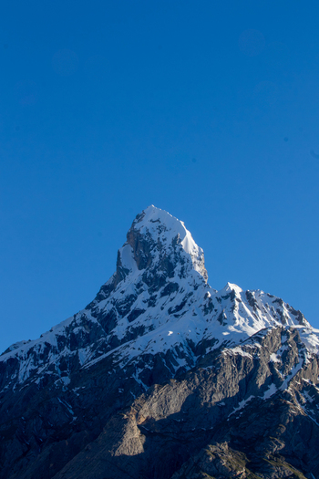 View of the snow capped peak of K2 rising against a clear blue sky in the Karakoram range in Gilgit Pakistan. View of the snow capped peak of K2 rising against a clear blue sky in the Karakoram range in Gilgit Pakistan.