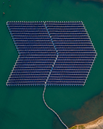 Aerial view of floating solar farm on a lake with turquoise water Bensheim Hessen Germany. Aerial view of floating solar farm on a lake with turquoise water Bensheim Hessen Germany.