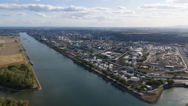 Aerial view of the BASF chemical plant along the Rhine river with industrial infrastructure storage tanks and urban surroundings in Ludwigshafen am Rhein Rheinland Pfalz Germany.