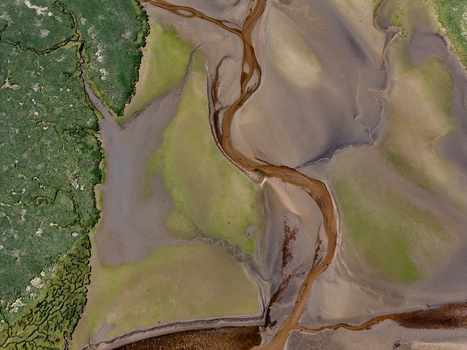 Aerial view of the winding water channels and green marshland of Findhorn Bay in Findhorn Scotland United Kingdom. Aerial view of the winding water channels and green marshland of Findhorn Bay in Findhorn Scotland United Kingdom.
