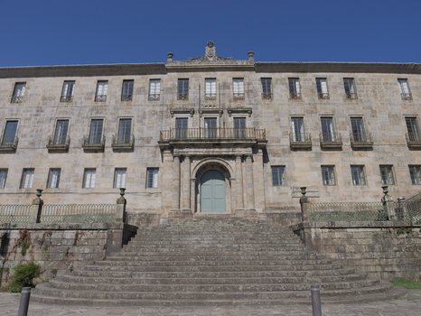 View of the historic stone facade of the Convento e Igrexa de San Francisco featuring a grand staircase arched entrance and symmetrical windows in Pontevedra Pontevedra Spain. View of the historic stone facade of the Convento e Igrexa de San Francisco featuring a grand staircase arched entrance and symmetrical windows in Pontevedra Pontevedra Spain.