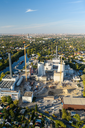 Aerial view of the Combined Heat and Power Plant Lichterfelde during deconstruction featuring cooling towers construction cranes and industrial structures in Berlin Berlin Germany. Aerial view of the Combined Heat and Power Plant Lichterfelde during deconstruction featuring cooling towers construction cranes and industrial structures in Berlin Berlin Germany.