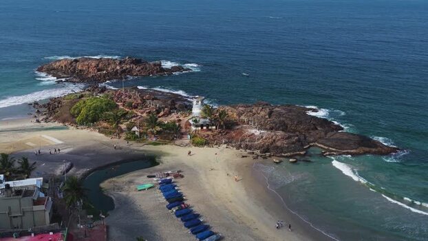 Aerial view of the rocky coastline and lighthouse in Kovalam India. Aerial view of the rocky coastline and lighthouse in Kovalam India.