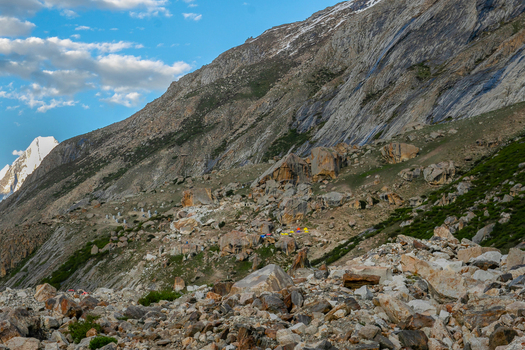 View of the rocky mountain terrain and boulders along the Gasherbrum IV trek under a blue sky Skardu Gilgit Pakistan. View of the rocky mountain terrain and boulders along the Gasherbrum IV trek under a blue sky Skardu Gilgit Pakistan.