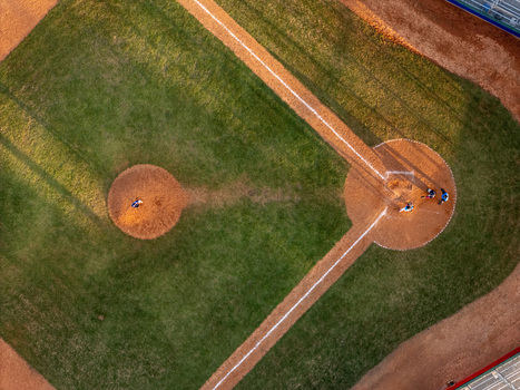 Aerial view of a baseball field with a pitcher on the mound and players near home plate in Santo Domingo Distrito Nacional Dominican Republic.