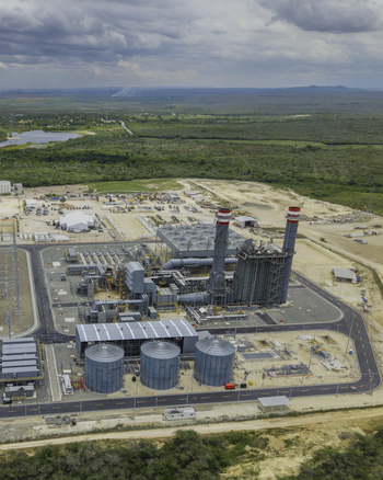 Aerial view of Manzanillo Power Plant featuring tall chimneys large industrial storage tanks and surrounding infrastructure in Pepillo Salcedo Monte Cristi Province Dominican Republic. Aerial view of Manzanillo Power Plant featuring tall chimneys large industrial storage tanks and surrounding infrastructure in Pepillo Salcedo Monte Cristi Province Dominican Republic.