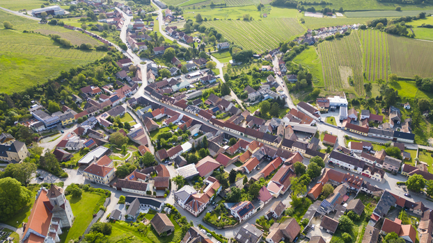 Aerial view of the town s terracotta rooftops nestled amid the lush green fields and vineyards Falkenstein bei Poysdorf Lower Austria Austria. Aerial view of the town s terracotta rooftops nestled amid the lush green fields and vineyards Falkenstein bei Poysdorf Lower Austria Austria.
